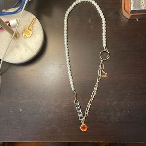 Womans mixed material necklace with pendant only tried on once